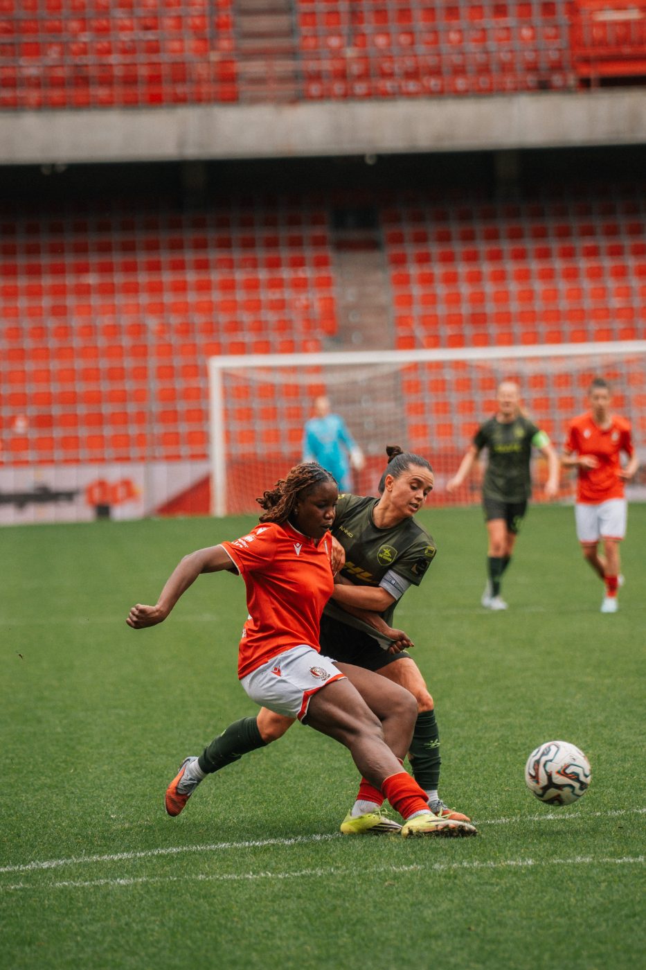 women’s team forward strikes at goal