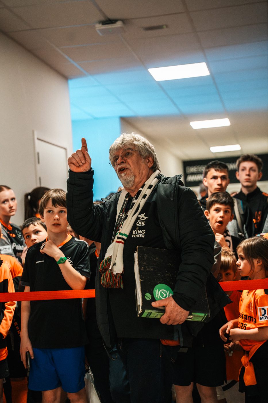 a guide leads a stadium tour