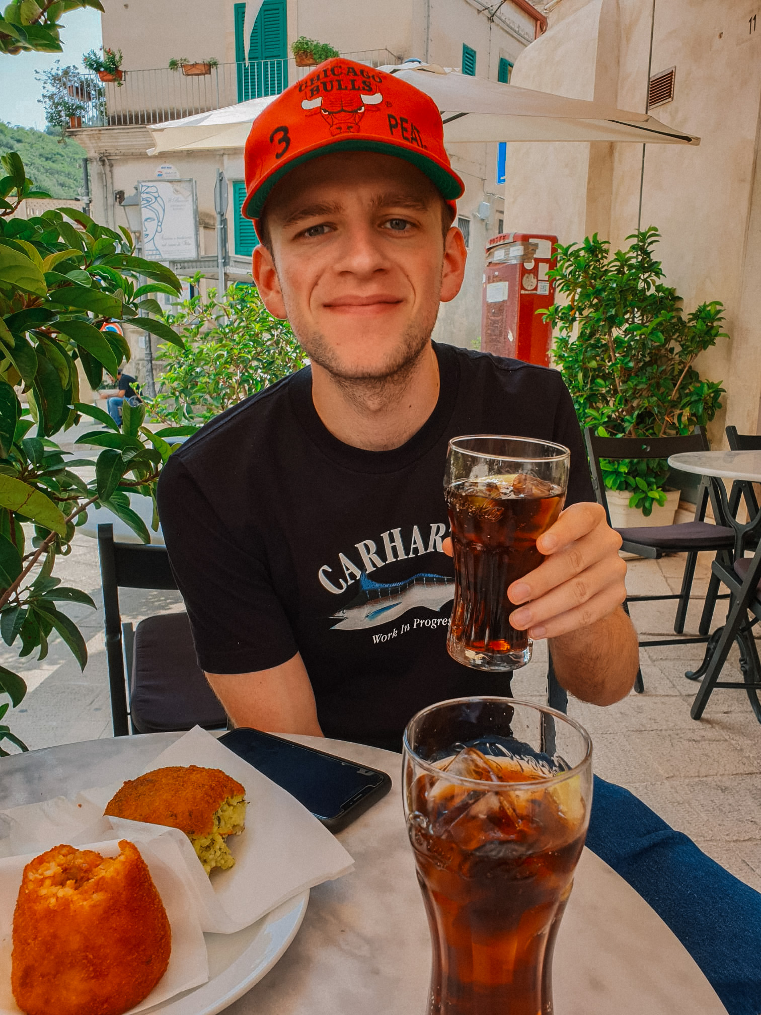 Kasper Schauwers at a café table in Italy